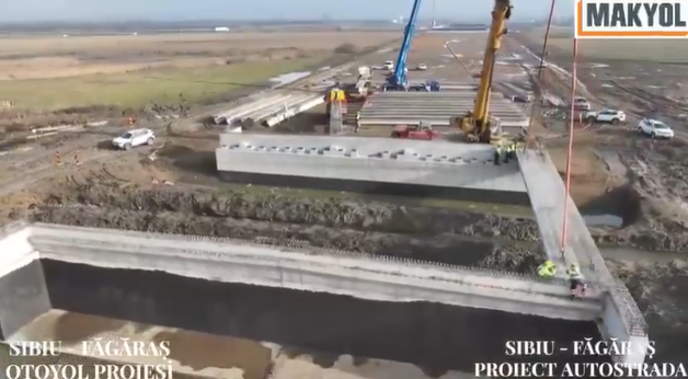 Autostrada A13 Sibiu – Făgăraș: Makyol din Turcia a instalat prima grindă pe tronsonul 2 1 video autostrada a13 sibiu fagaras turcii de la makyol au montant prima grinda pe tronsonul 2 6932b31e2e73c